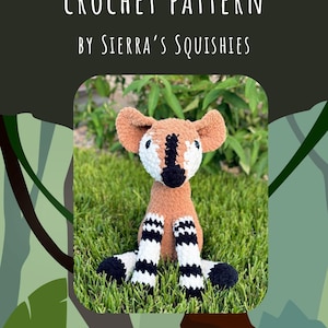 May include: Crochet pattern for a brown and white okapi amigurumi toy. The pattern is called "Opi the Okapi Crochet Pattern" and is by Sierra's Squishes. The pattern includes instructions for making the toy and is available for personal use only.