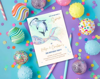May include: A birthday party invitation with a mermaid tail and hammerhead sharks, with the text "Dive in and make a Splash". The invitation is surrounded by colorful candies and confetti on a blue and purple background.