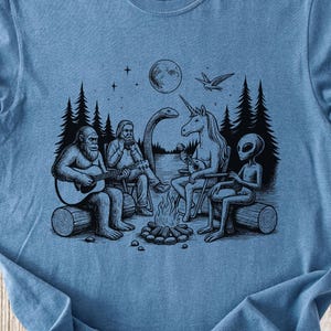 Bigfoot Shirt, Comfort Colors Cryptid Campfire Shirt with Bigfoot, Alien, Unicorn Playing Instruments, Funny Tee for Mythical Believers