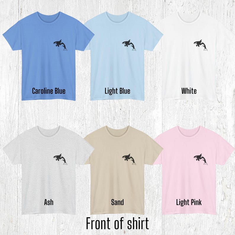 Various color shirts showing small black Orca design on the front.