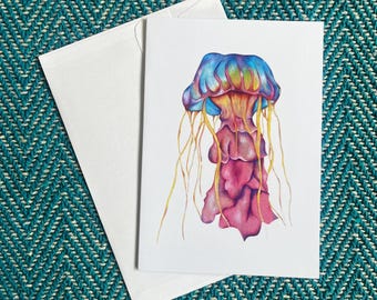 Tarjeta de felicitación de medusa dibujada a mano: Ilustración colorida del océano