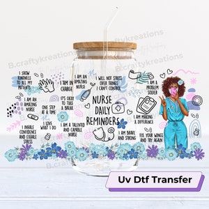 May include: A clear glass tumbler with a wooden lid and a straw. The tumbler has a UV DTF transfer design with a cartoon illustration of a Black woman wearing a blue nurse uniform and a face mask. The design includes text that says "Nurse Daily Reminders" and other motivational phrases for nurses.