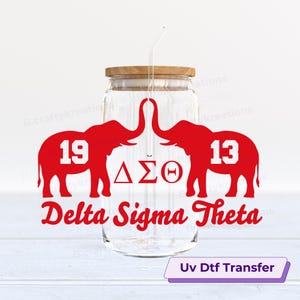 May include: A clear glass jar with a wooden lid and a straw. The jar features red elephant graphics with the numbers "19" and "13", the Greek letters "ΔΣΘ", and the words "Delta Sigma Theta". The text "UV Dtf Transfer" is also present.
