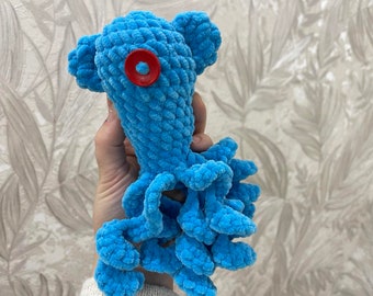 Plush octopus Coraline, a squid with a single button