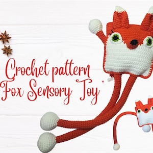 May include: Crochet pattern for a fox sensory toy. The toy is red and white with long, dangling legs. The pattern includes instructions for making a smaller fox toy as well.
