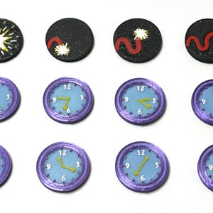 May include: Twelve purple and blue clock face tokens with yellow hands and white numbers. Four black tokens with red and white designs.