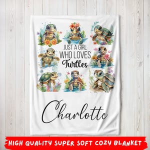 May include: White fleece blanket with a design of multiple cartoon turtles and the text "Just a girl who loves turtles" and the name "Charlotte".