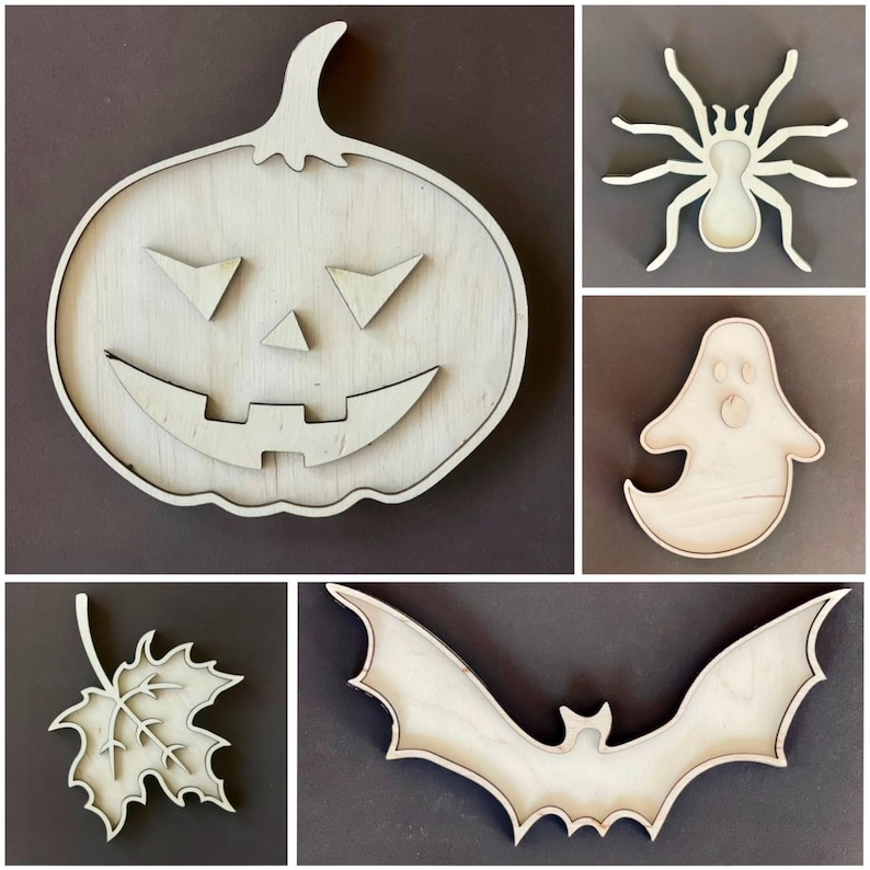 May include: Five unfinished wooden Halloween decorations: a pumpkin, a bat, a spider, a ghost, and a maple leaf. The decorations are all cut out of wood and have a natural wood finish.