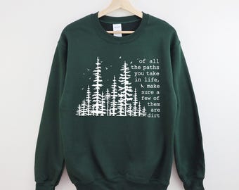 May include: Dark green sweatshirt with a white graphic of stylized trees and the text "of all the paths you take in life, make sure a few of them are dirt."