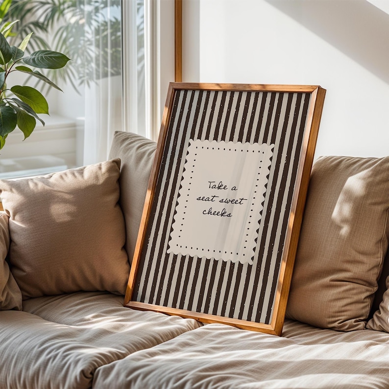 Cozy cottage powder room art print with vintage stripe design and warm neutral color palette