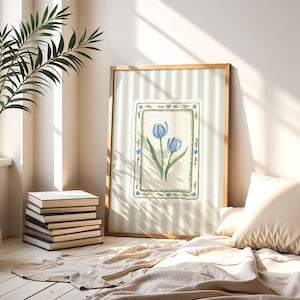 Blue tulip flower artwork with hand-painted botanical detail, set against soft green vintage stripes and bordered by floral motifs, printable wall art
