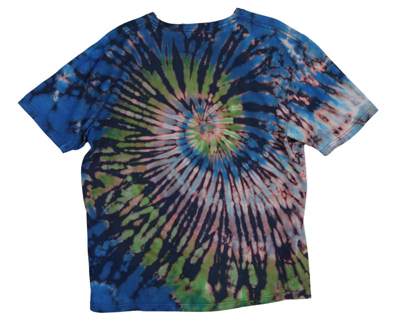 May include: A short-sleeved t-shirt with a spiral tie-dye pattern. The shirt features a blend of blue, green, pink, and black colors. The design radiates from the center of the shirt, creating a unique and colorful look.
