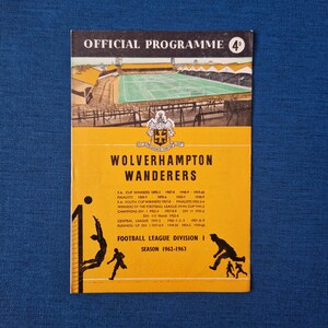 May include: A yellow and black programme for a Wolverhampton Wanderers football match. The programme cover features a photo of the team's stadium, a crest, and the text "OFFICIAL PROGRAMME 4d". The programme is for the 1962-1963 season.