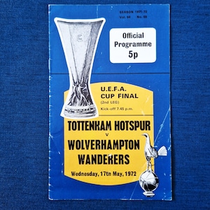 May include: A football programme from the 1971-72 season, with a blue and yellow design. It announces the U.E.F.A. Cup Final (2nd Leg) between Tottenham Hotspur and Wolverhampton Wanderers, kicking off at 7.45 p.m. on Wednesday, 17th May, 1972. The price is 5p.