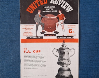 May include: Vintage Manchester United Football Club "United Review" program from the 1965-66 season. The cover features illustrations of players and a football, with text including "F.A. Cup" and "Official Programme". The program is in black, red, and white.