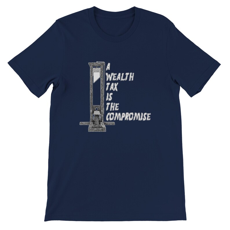 May include: Navy blue t-shirt featuring a guillotine graphic with the text "A Wealth Tax Is The Compromise" in white. The design is centered on the front of the shirt, offering a bold statement. The shirt is made of a soft material.