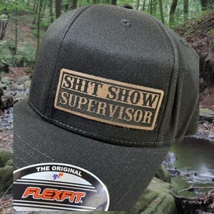 Shitshow Supervisor Hat: Laser Engraved Leather Patch FlexFit Cap
