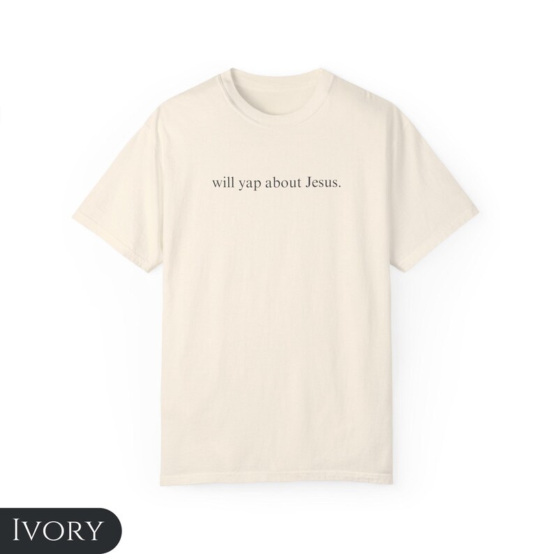 May include: A cream colored t-shirt with the text "will yap about Jesus." printed on the front.