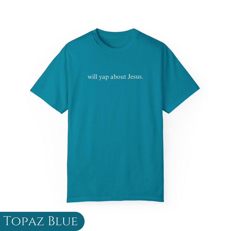 May include: A turquoise blue t-shirt with the text "will yap about Jesus." printed in white on the front.