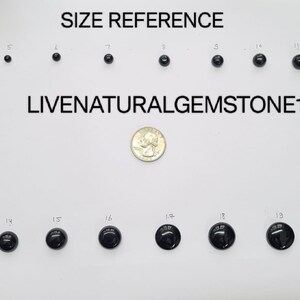 May include: Size reference chart for black round gemstones, showing the size of each gemstone in inches, from 4 inches to 20 inches. A US quarter is included for scale.