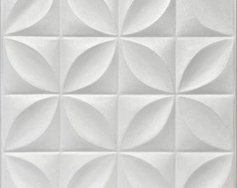 May include: A square, white, textured wall panel with a repeating pattern of four-petal flower-like shapes. The design is raised, creating a three-dimensional effect. The panel is divided into sixteen squares.