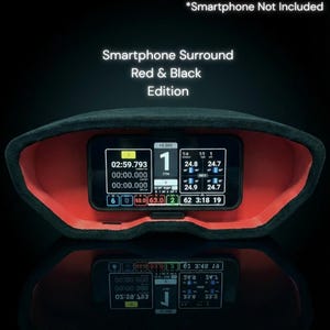 Puede incluir: Un soporte para smartphone rojo y negro con el texto "Smartphone Surround Red & Black Edition". El soporte muestra datos en una pantalla, incluyendo números y mediciones de tiempo. También se ve el texto "*Smartphone Not Included".