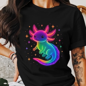 May include: Black t-shirt with a neon-coloured axolotl design. The axolotl has a rainbow gradient body and pink gills, set against a backdrop of stars. A fun and colourful graphic, perfect for those who love unique designs.