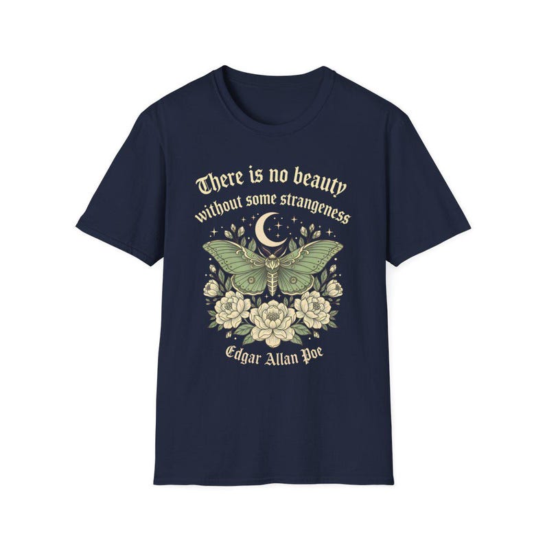 May include: Navy blue t-shirt featuring a green moth design with a crescent moon and floral accents. The shirt includes the quote "There is no beauty without some strangeness" and the name "Edgar Allan Poe".