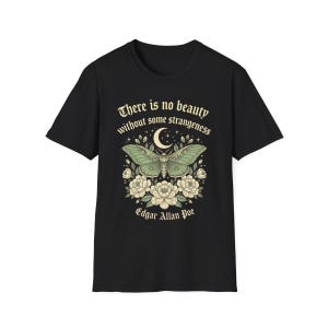 May include: Black t-shirt featuring a green moth design with a crescent moon and floral accents. The text "There is no beauty without some strangeness" and "Edgar Allan Poe" are printed above and below the moth illustration.
