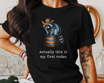 Actually This Is My First Rodeo T-Shirt - Funny Western Graphic Tee Raccoon Quote Shirt Cowboy Shirt