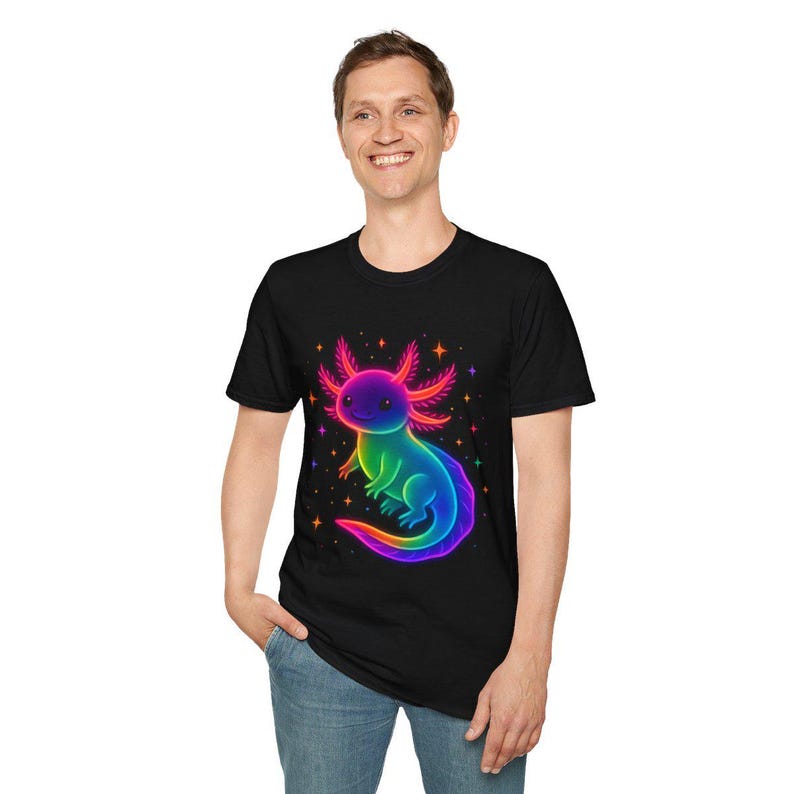 May include: Black t-shirt with a colourful axolotl illustration. The axolotl is rendered in rainbow colours, with a smiling expression and star details. The t-shirt has a crew neck.