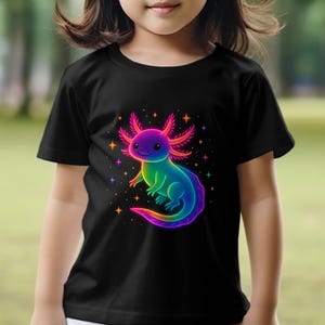 May include: Black t-shirt with a colourful axolotl illustration. The axolotl is rendered in rainbow colours, with a smiling expression and star accents. The shirt is made of a soft material and is suitable for children.