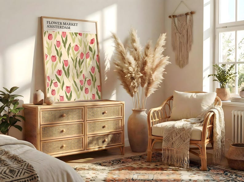 Bright boho living space with rattan furniture and a large Amsterdam flower market print in a light wood frame.