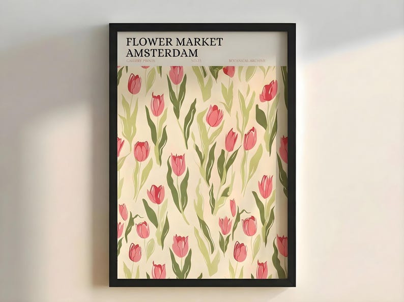 Flat lay view of the framed pastel botanical Amsterdam tulip poster against a plain light background.
