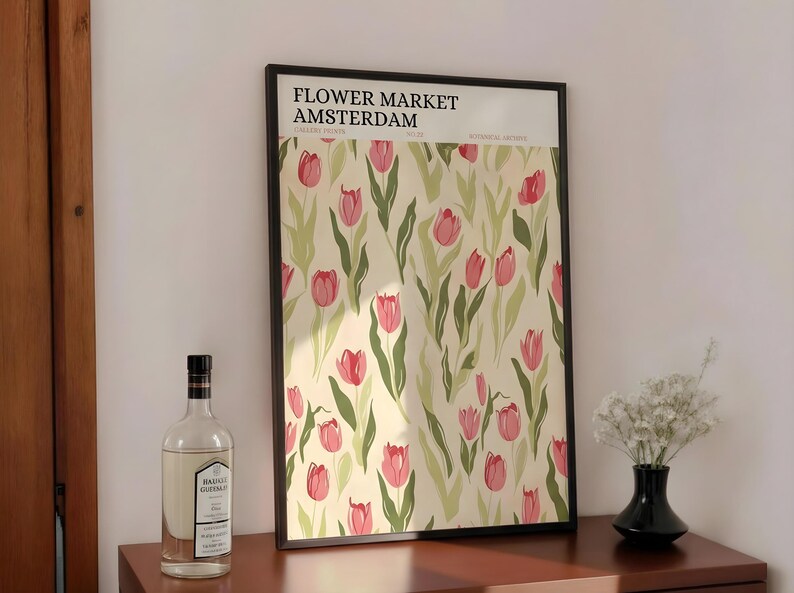 Boho style shelf decor with a retro Amsterdam flower market tulip poster leaned next to glass vases and botanicals.
