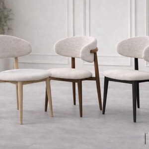 May include: Three chairs with off-white textured fabric seats and curved backrests. The frames are made of wood in three distinct finishes: light natural wood, medium brown wood, and black. The text HOMEIYA is visible in the bottom right corner.