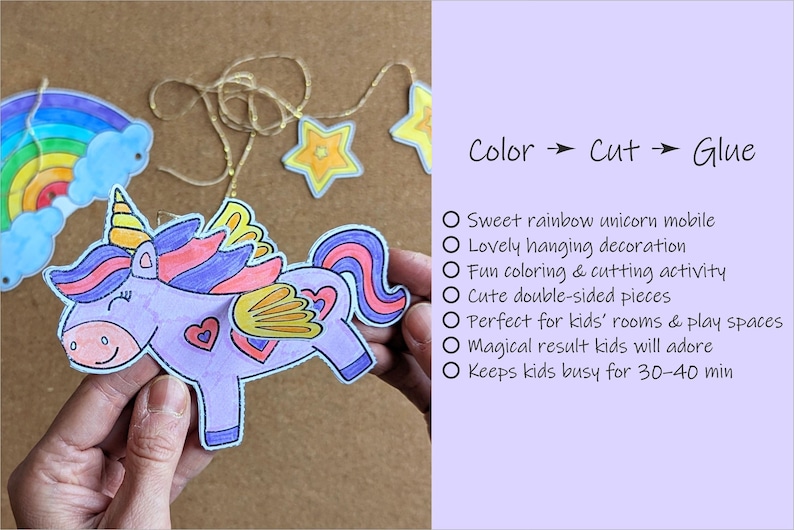May include: A colourful unicorn mobile with a rainbow and stars. The unicorn is purple with a yellow horn, pink hearts, and wings. The text on the right says "Color -> Cut -> Glue".