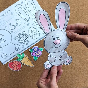 May include: A spring bunny craft kit with a gray and pink bunny cutout, along with other colorful cutouts of a carrot, flower, and egg. The kit includes a sheet with instructions and bunny parts.