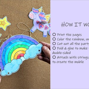 May include: A craft kit with a rainbow, unicorn, and stars. The rainbow has blue, green, yellow, and red arches with blue clouds. The text "HOW IT WORKS" is visible, along with instructions for creating a mobile.