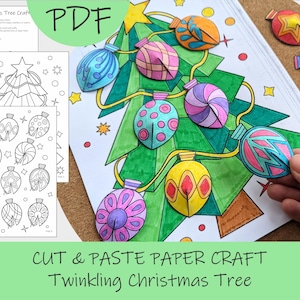 Op de afbeelding: Een kleurrijke papieren kerstboom met uitgesneden ornamenten. De afbeelding toont een groene boom met papieren ornamenten in verschillende kleuren en patronen. De tekst "CUT & PASTE PAPER CRAFT Twinkling Christmas Tree" is zichtbaar.