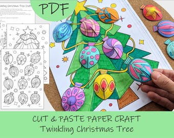 May include: A colorful paper craft Christmas tree with cut-out ornaments. The image includes a green tree with paper ornaments in various colors and patterns. The text "CUT & PASTE PAPER CRAFT Twinkling Christmas Tree" is visible.