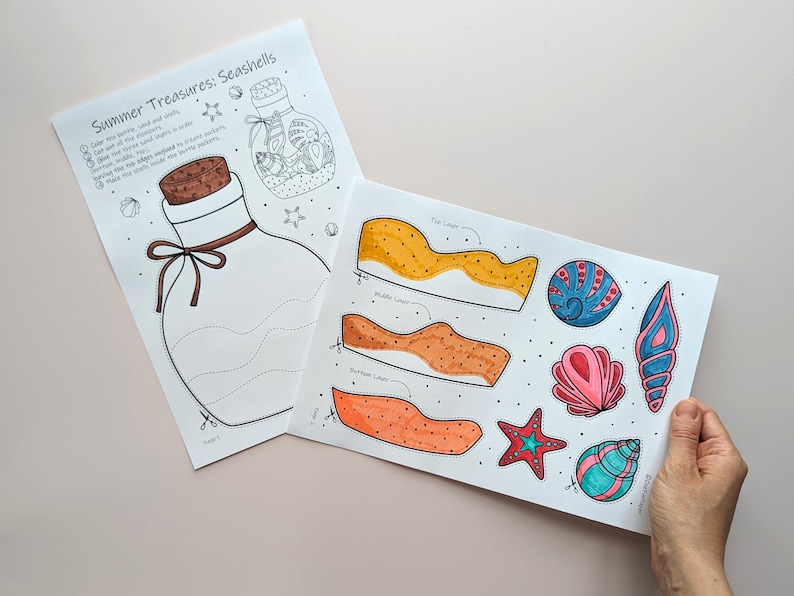 May include: Two sheets of paper with seashell-themed illustrations. One sheet features a large bottle with a cork and bow, and the text "Summer Treasures: Seashells." The other sheet displays colorful seashell cutouts.