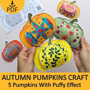 May include: A set of paper pumpkin crafts featuring various colorful patterns including floral, leaf, and geometric designs. The pumpkins are layered to create a three-dimensional puffy effect. A PDF instruction sheet with a download icon is visible.