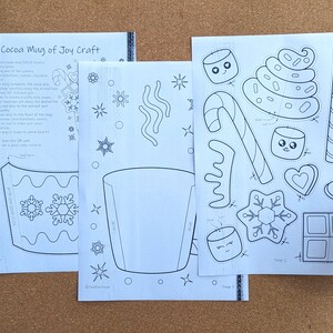 Peut inclure: Trois feuilles de papier blanc avec des dessins au trait noirs pour un bricolage de tasse de cacao. Les feuilles comprennent des instructions, un mod&egrave;le de tasse et des formes d&eacute;coup&eacute;es de guimauves, de cannes en bonbon et de flocons de neige. Le texte "Cocoa Mug of Joy Craft" est visible.