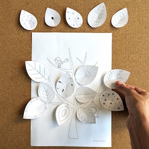 May include: A black and white printable craft activity featuring a tree with branches and a bird.  The tree has eight leaves with different patterns that can be cut out and glued on.  The text "Paper Crafts" is at the bottom of the page.