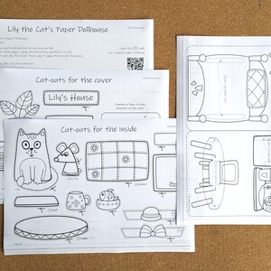 May include: Paper dollhouse kit with instructions and cut-out sheets. The sheets feature line drawings of a cat, mouse, furniture, and the text "Lily's House". The kit includes a QR code for video instructions.