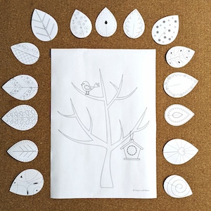 May include: A black and white printable craft activity featuring a tree with a bird and a birdhouse.  The tree has branches that are bare and the birdhouse is hanging from one of the branches.  There are 14 leaves with different patterns around the tree.  The leaves are ready to be cut out and glued to the tree.