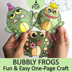 Könnte beinhalten: Drei Frosch-Papierfiguren mit grüner Haut, gelben Bäuchen und Punkten. Ein Frosch trägt einen lila Partyhut, einer eine gelbe Krone und einer hat eine rosa Blume und streckt die Zunge heraus. Der Text PDF ist oben im Bild zu sehen.