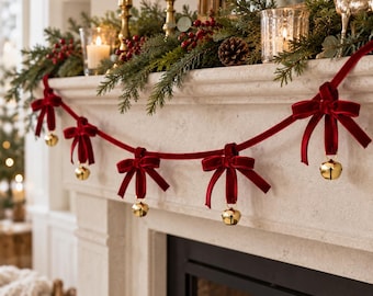 May include: A decorative garland featuring a deep red velvet ribbon draped in swags, accented with multiple tied velvet bows. Each bow is adorned with a small, polished gold-toned metal jingle bell hanging from the center of the knot.