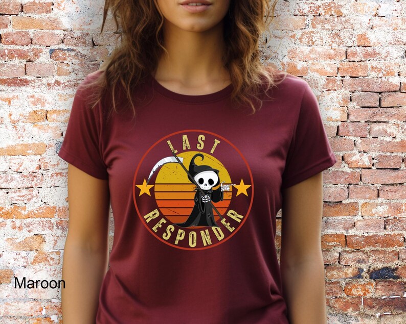May include: A maroon t-shirt with a retro-style graphic of a cartoon Grim Reaper holding a coffee cup. The graphic is surrounded by a circle with the text "Last Responder" in white.